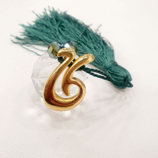 Διακοσμητικό γούρι 2026 από κρύσταλλο διαφανές με λεπτομέρειες κρυσταλλάκια πράσινα και πράσινη φούντα 