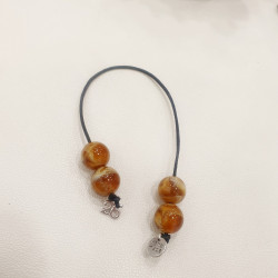 Μπεγλέρι γούρι 2026 με χάντρα ταμπά