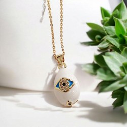 Κολιέ Αυγό βυζαντινό λευκό με μάτι με μακριά αλυσίδα ατσάλινη L316  σε χρυσό χρώμα