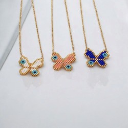 Κολιέ πεταλούδα με χάντρες miyuki σε χρώμα λευκό με ματάκια και περίγραμμα σε χρυσό με αλυσίδα από ατσάλι L316