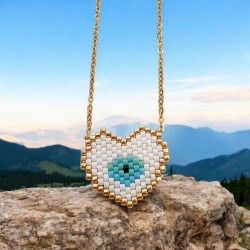 Κολιέ καρδιά με χάντρες miyuki σε χρώμα λευκό με ματάκι και περίγραμμα σε χρυσό με αλυσίδα από ατσάλι L316